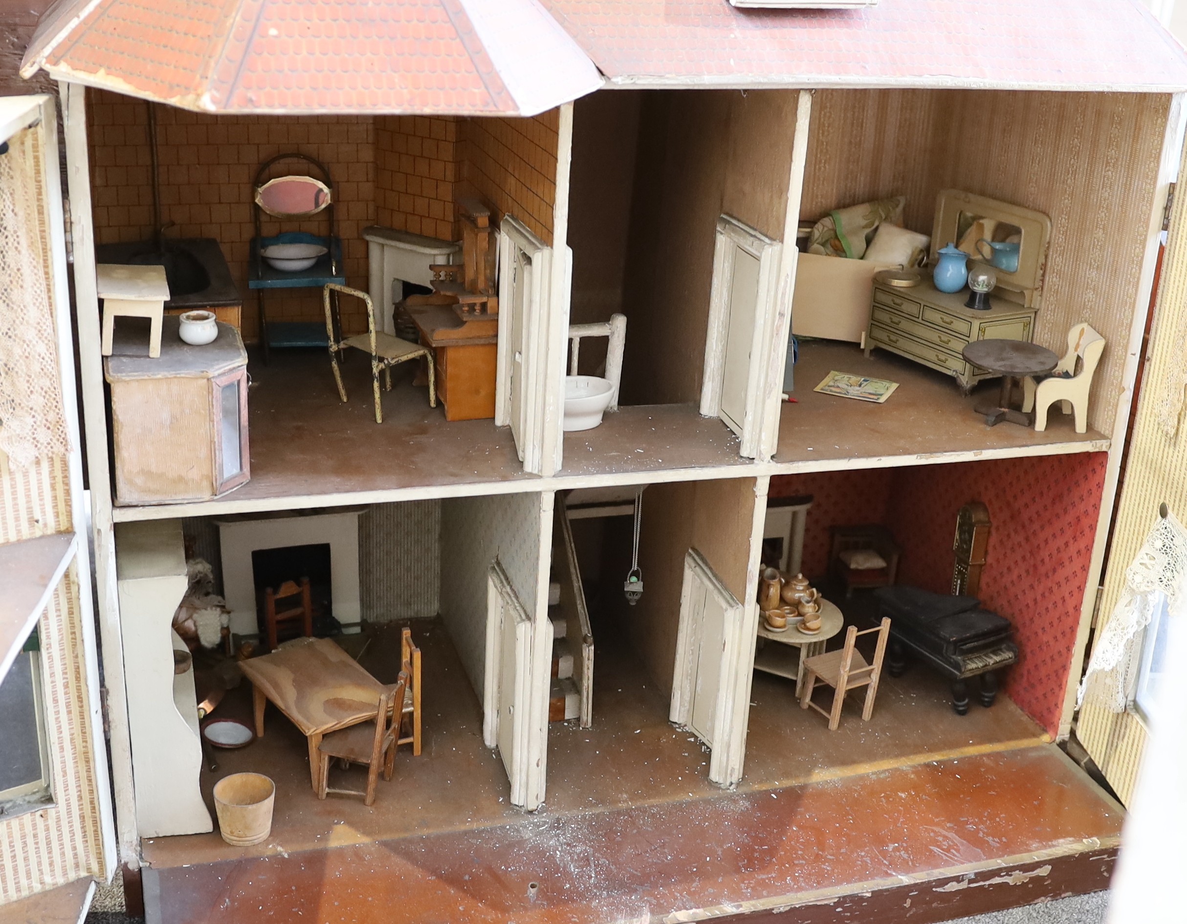 A G. and J. Lines furnished dolls’ house of 'Kits Koty' type, early 20th century, 92cm high.